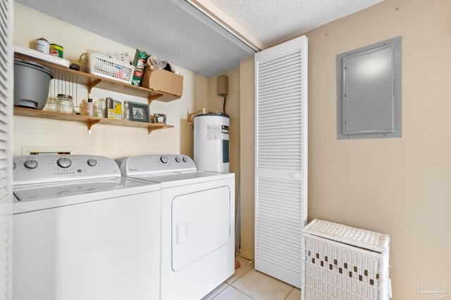 laundry room with light tile patterned flooring, water heater, electric panel, independent washer and dryer, and a textured ceiling