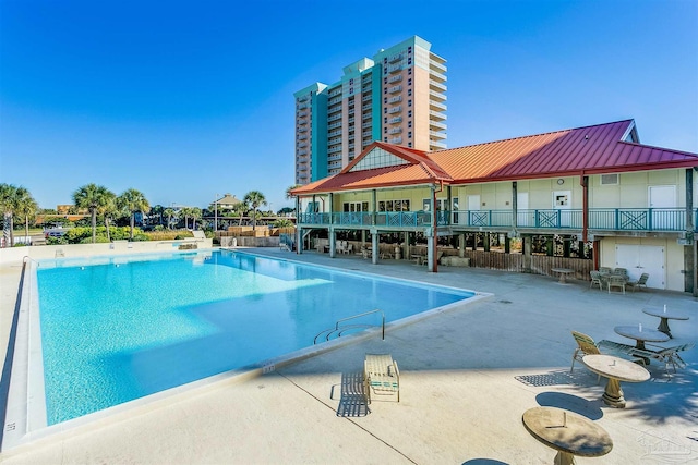 view of swimming pool featuring a patio area