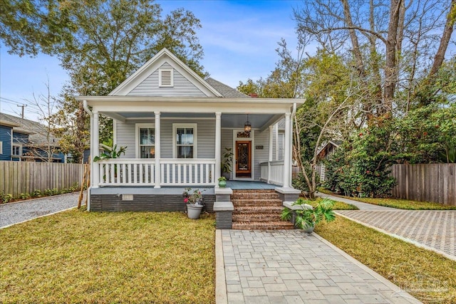 bungalow-style house with a front yard and a porch