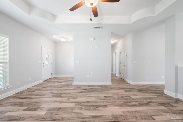 unfurnished room featuring light hardwood / wood-style floors and ceiling fan