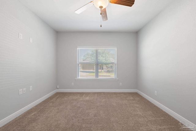 carpeted empty room featuring ceiling fan