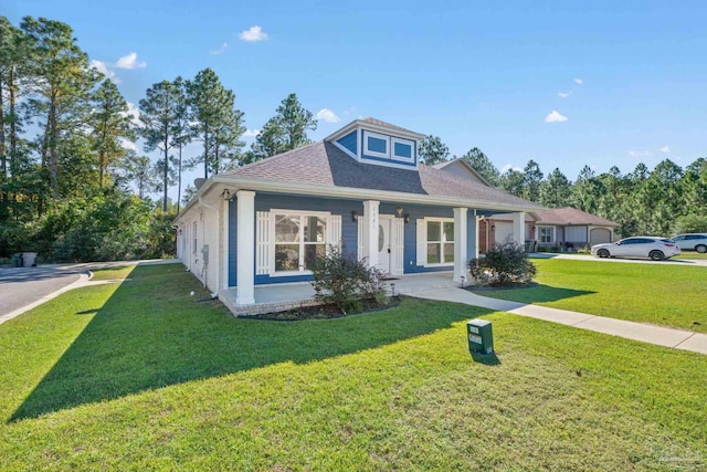 view of front of house with covered porch and a front yard