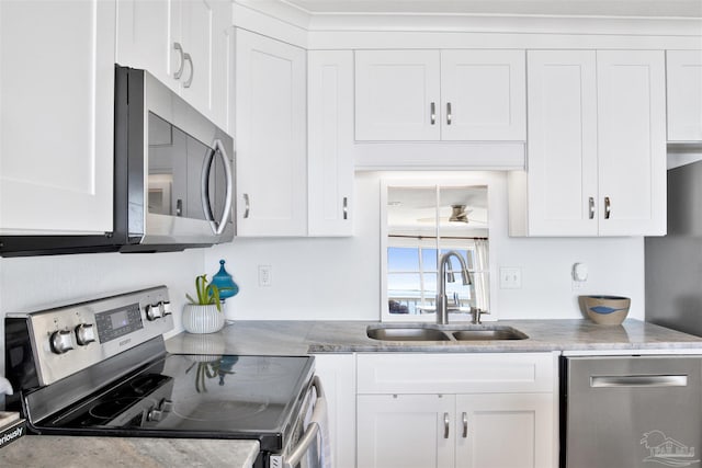 kitchen with white cabinetry, sink, and appliances with stainless steel finishes