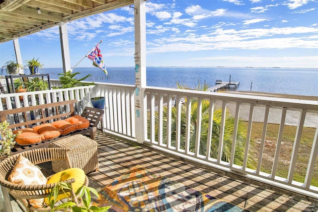 exterior space featuring a boat dock and a water view