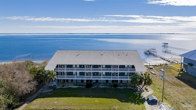 birds eye view of property with a water view