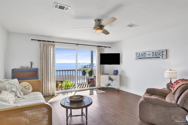 living room with dark hardwood / wood-style flooring and ceiling fan