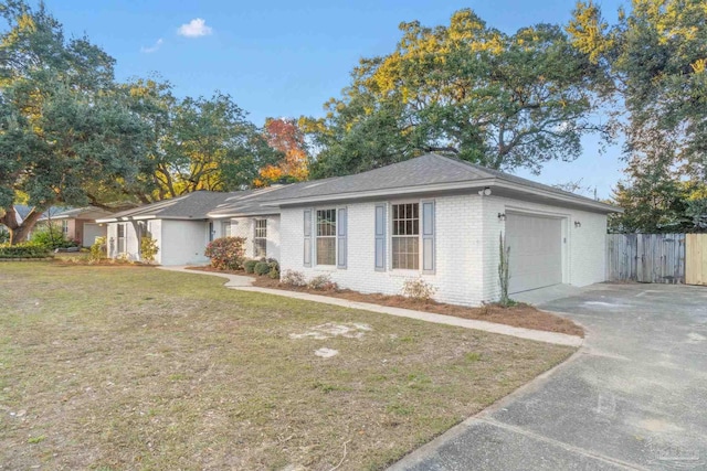 ranch-style house with a front lawn and a garage