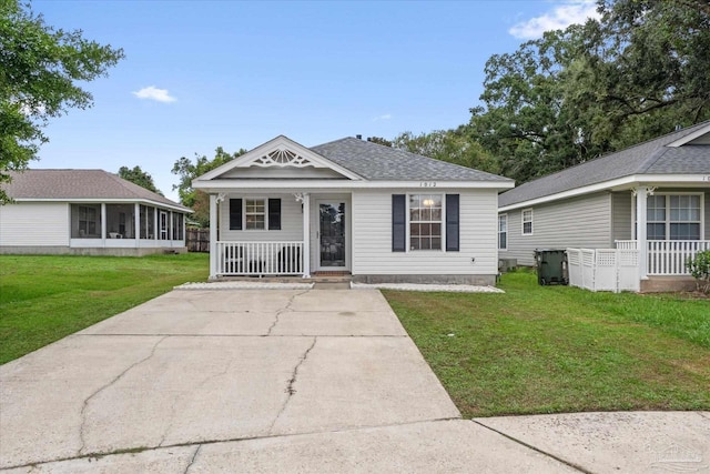 view of front of home with a front yard and a porch