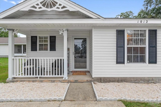 property entrance with covered porch