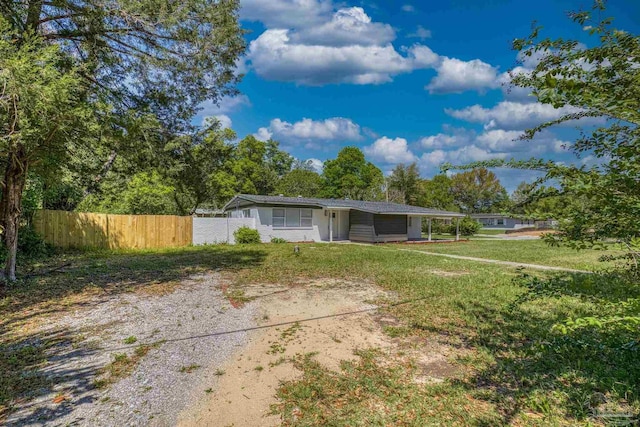 1029 Kearny Dr, Pensacola, FL 32505 - exterior space featuring fence and a lawn