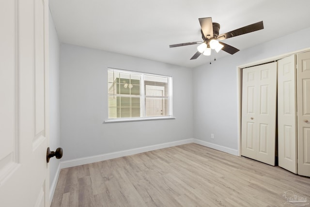 1029 Kearny Dr, Pensacola, FL 32505 - unfurnished bedroom with baseboards, light wood-type flooring, ceiling fan, and a closet