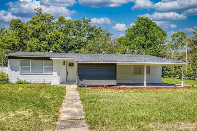 1029 Kearny Dr, Pensacola, FL 32505 - view of front of property with brick siding and a front lawn