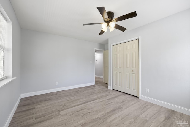 1029 Kearny Dr, Pensacola, FL 32505 - unfurnished bedroom featuring a closet, a ceiling fan, wood finished floors, and baseboards