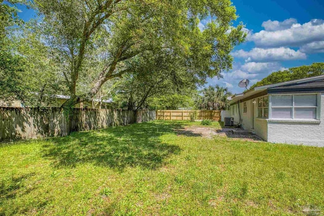 1029 Kearny Dr, Pensacola, FL 32505 - view of yard with a fenced backyard and central AC unit