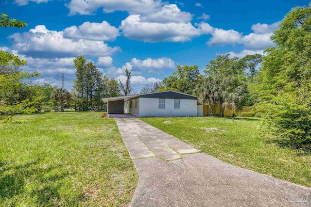1029 Kearny Dr, Pensacola, FL 32505 - view of front of home with a carport, a front lawn, and driveway