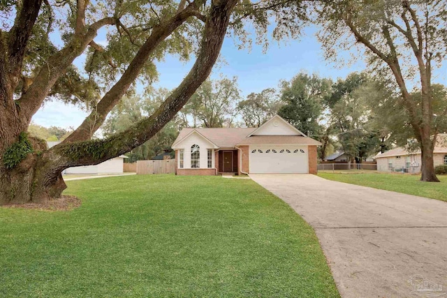 ranch-style home with brick siding, an attached garage, fence, driveway, and a front lawn