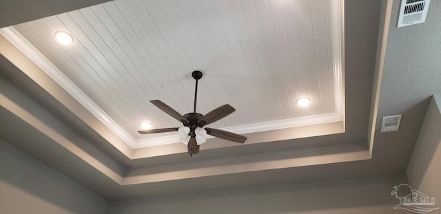 interior details with visible vents, recessed lighting, crown molding, and a raised ceiling