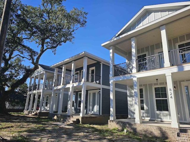 exterior space featuring a porch and board and batten siding