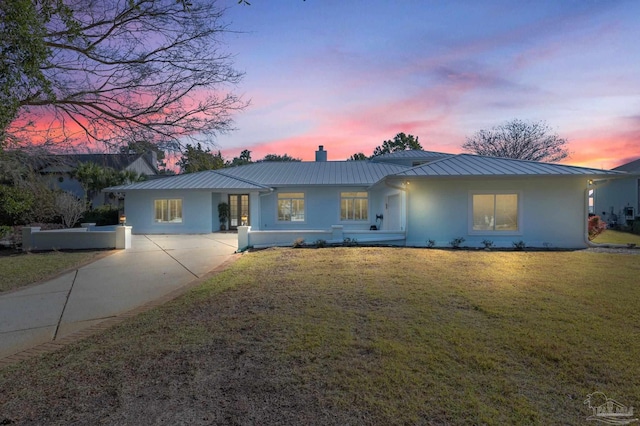 ranch-style house with a yard