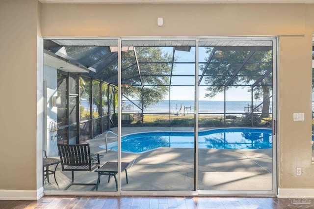 view of swimming pool with a water view