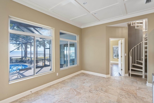 unfurnished room featuring coffered ceiling