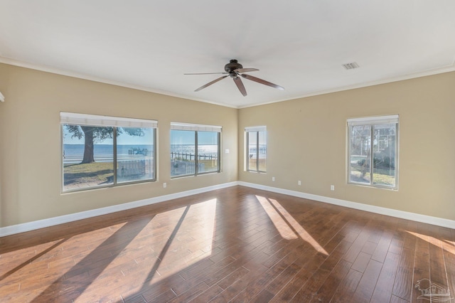 spare room with ceiling fan, crown molding, dark hardwood / wood-style flooring, and a water view