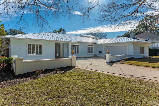 single story home with a front lawn and a garage