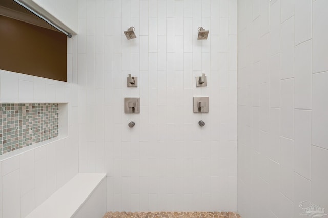 bathroom with a tile shower