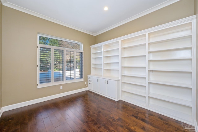 empty room with dark wood-type flooring and ornamental molding