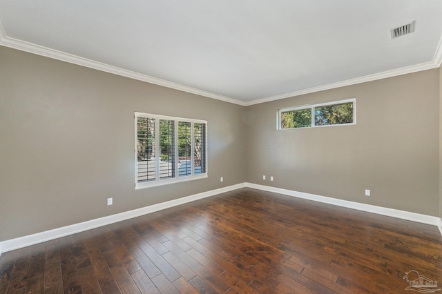 empty room featuring ornamental molding and dark hardwood / wood-style floors