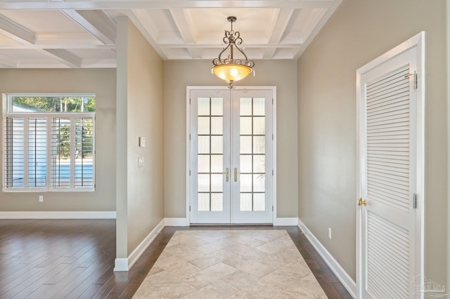 doorway with beam ceiling, dark hardwood / wood-style flooring, french doors, and coffered ceiling