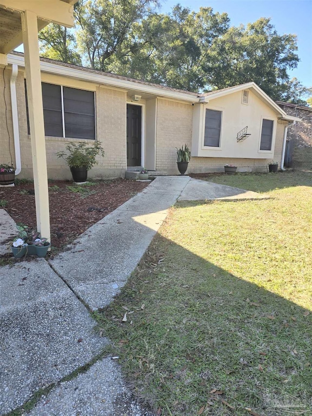 ranch-style house with a front yard