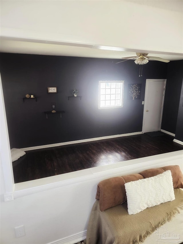 bedroom featuring ceiling fan and wood-type flooring