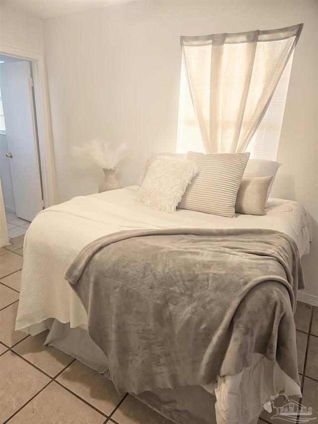 bedroom featuring light tile patterned floors