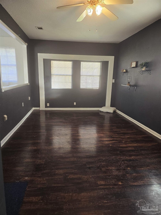 unfurnished room featuring ceiling fan and hardwood / wood-style floors