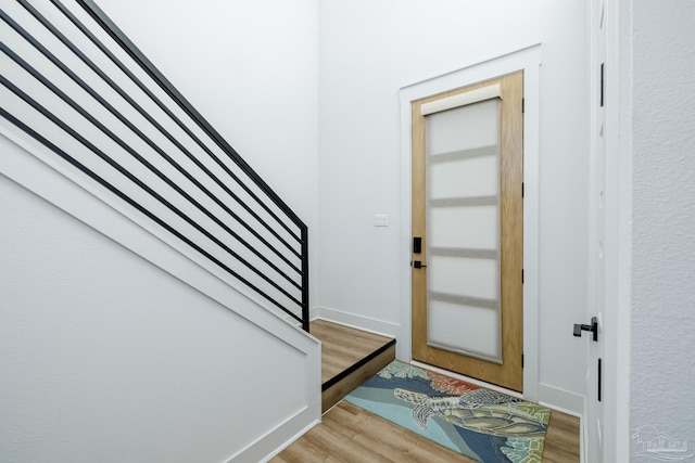 entryway with light hardwood / wood-style floors