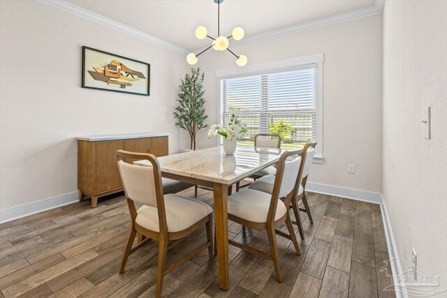 1412 Areca Palm Dr, Gulf Breeze, FL 32563 - dining room featuring crown molding, wood finished floors, and a chandelier