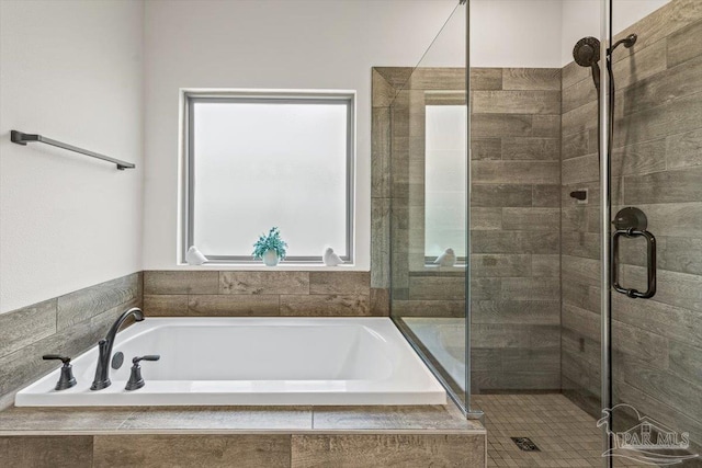 1412 Areca Palm Dr, Gulf Breeze, FL 32563 - bathroom with a stall shower, healthy amount of natural light, and a garden tub