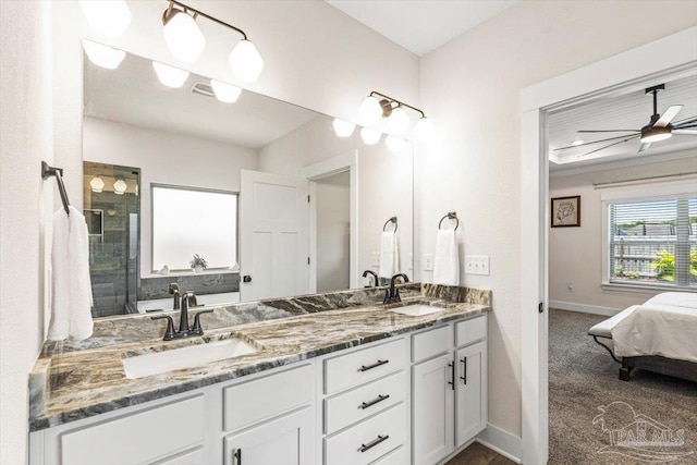 1412 Areca Palm Dr, Gulf Breeze, FL 32563 - bathroom featuring double vanity, connected bathroom, and tiled shower