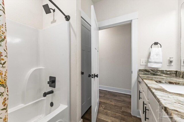 1412 Areca Palm Dr, Gulf Breeze, FL 32563 - full bath with wood finished floors, shower / bathtub combination, and vanity