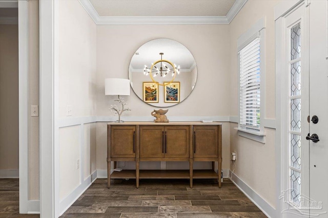 1412 Areca Palm Dr, Gulf Breeze, FL 32563 - foyer entrance with dark wood-style floors, ornamental molding, a chandelier, and healthy amount of natural light