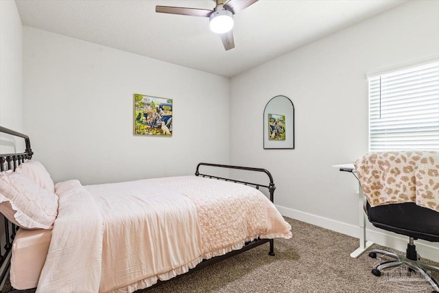 1412 Areca Palm Dr, Gulf Breeze, FL 32563 - carpeted bedroom with baseboards and a ceiling fan