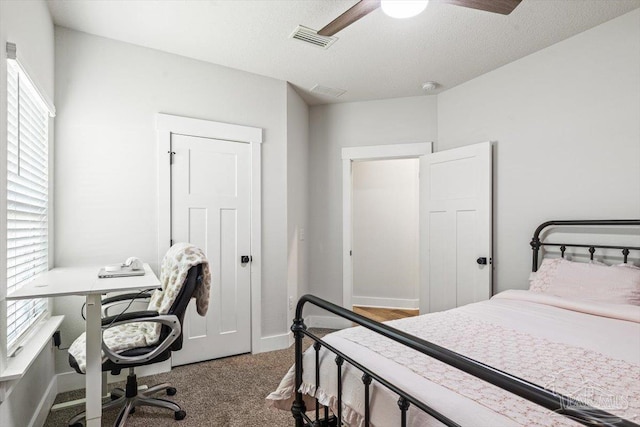1412 Areca Palm Dr, Gulf Breeze, FL 32563 - bedroom with carpet, a desk, a ceiling fan, and a textured ceiling