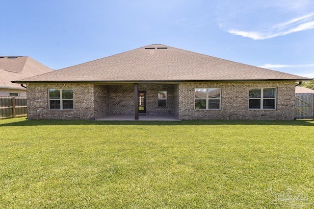 1412 Areca Palm Dr, Gulf Breeze, FL 32563 - back of property with a patio area, brick siding, and a shingled roof