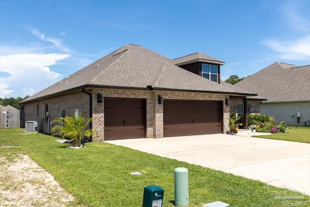 1412 Areca Palm Dr, Gulf Breeze, FL 32563 - view of front of property featuring a garage, driveway, brick siding, and roof with shingles