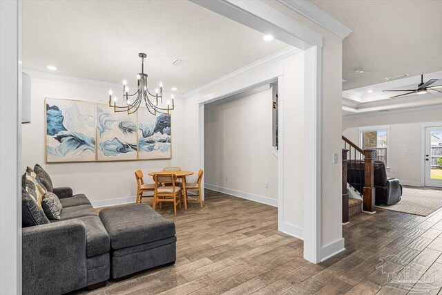 1412 Areca Palm Dr, Gulf Breeze, FL 32563 - sitting room with stairway, wood finished floors, crown molding, a chandelier, and recessed lighting