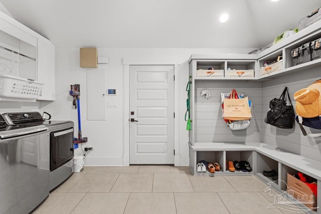 mudroom featuring washer and clothes dryer and light tile patterned floors