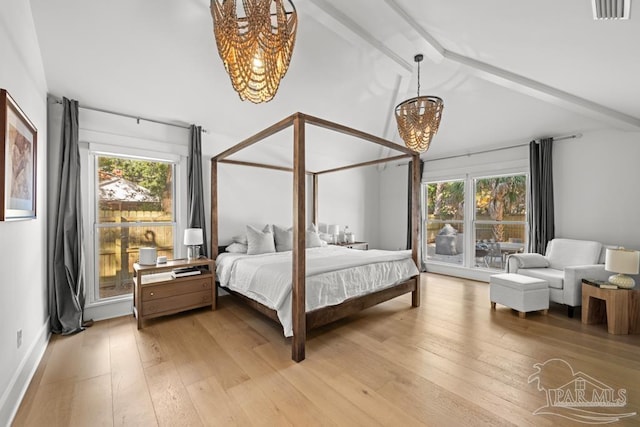 bedroom with an inviting chandelier, lofted ceiling with beams, and hardwood / wood-style flooring