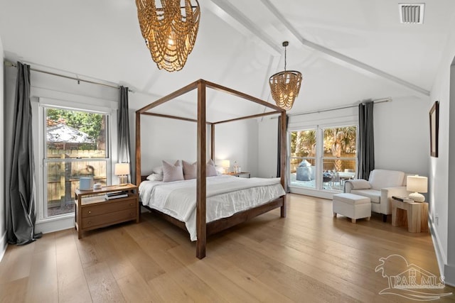 bedroom featuring beamed ceiling, wood-type flooring, a chandelier, and high vaulted ceiling