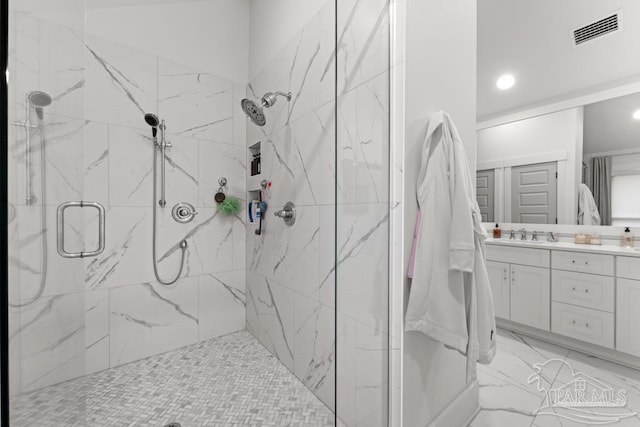 bathroom with vanity and an enclosed shower